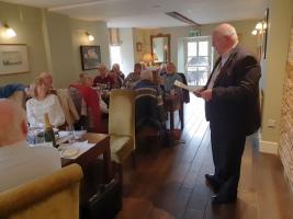 DG Ray Bevan during his talk, with club members